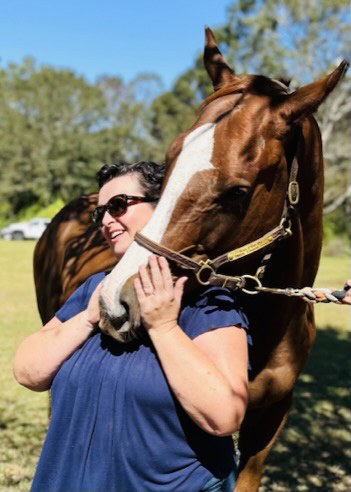 Horse Hugging Lady