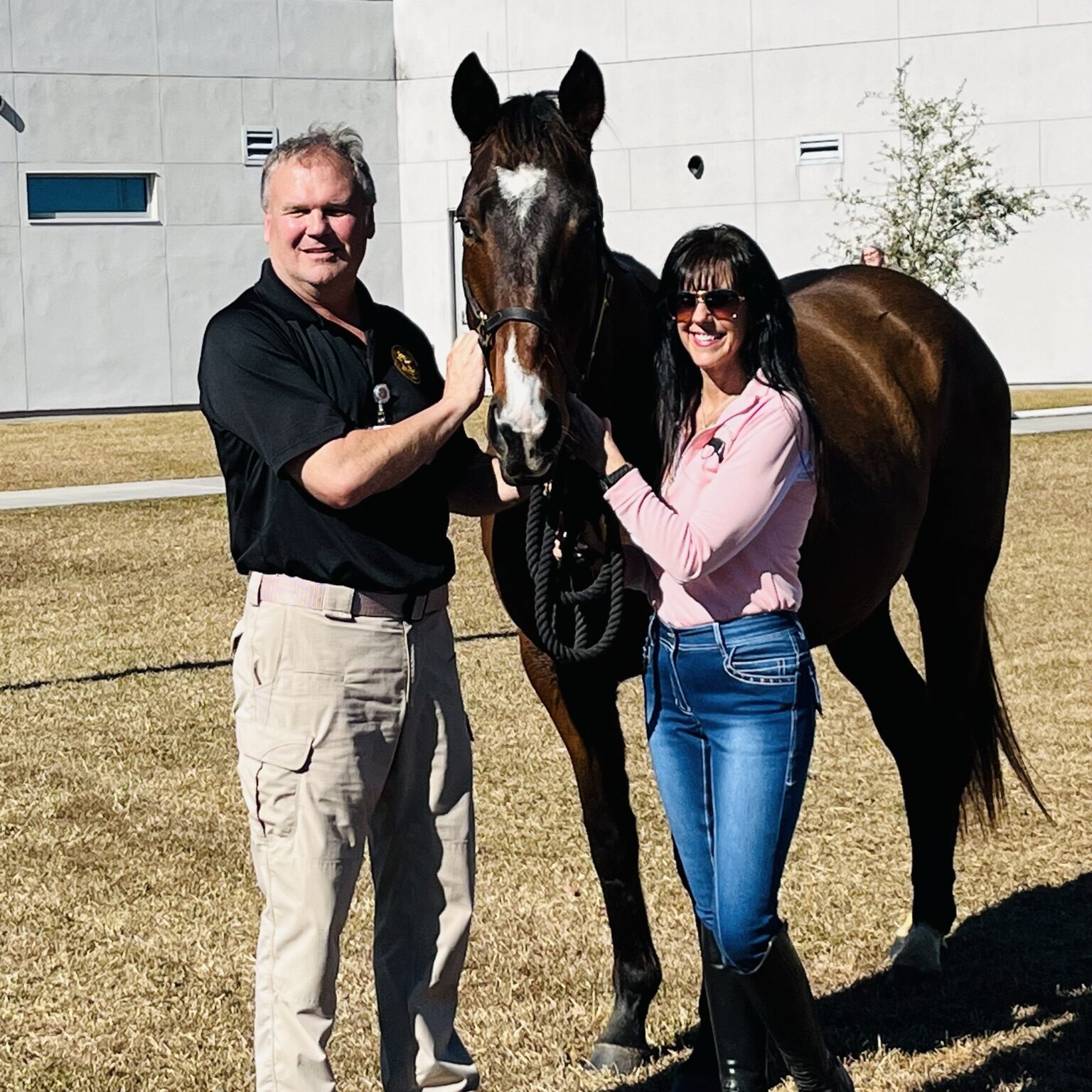 Photo of Kelly and Bear providing equine therapy services at a facility